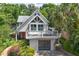 An appealing exterior featuring an elevated deck, modern garage door, and well-maintained landscaping at 421 W 10Th Ave, Mount Dora, FL 32757
