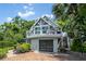 Stunning two-story home with a spacious balcony, a garage and lush landscaping at 421 W 10Th Ave, Mount Dora, FL 32757
