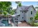 Back exterior of home with screened in pool, and stone mulch at 421 W 10Th Ave, Mount Dora, FL 32757
