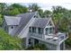 A residence featuring a spacious deck perfect for relaxation, nestled among trees and greenery at 421 W 10Th Ave, Mount Dora, FL 32757