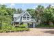 Charming two-story home featuring a spacious deck, modern garage, and lush landscaping at 421 W 10Th Ave, Mount Dora, FL 32757