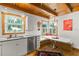 Bright and airy kitchen featuring ample countertop space and a cozy breakfast nook area at 421 W 10Th Ave, Mount Dora, FL 32757