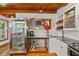Well-lit kitchen showcasing stainless steel appliances and a unique refrigerator at 421 W 10Th Ave, Mount Dora, FL 32757