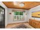 Sitting area boasting wood plank ceilings, travertine floors, and plantation shutters at 421 W 10Th Ave, Mount Dora, FL 32757
