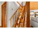 Wooden staircase leading to upper levels, featuring natural wood and craftsman detailing at 421 W 10Th Ave, Mount Dora, FL 32757