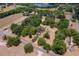 Aerial view of wooded property and neighborhood with houses and a lake in the distance at 43411 State Road 19, Altoona, FL 32702