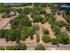 Aerial view of the property showcases beautiful trees, lush landscaping, and surrounding natural scenery at 43411 State Road 19, Altoona, FL 32702
