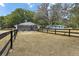 Fenced backyard with trees and a view of the house at 43411 State Road 19, Altoona, FL 32702