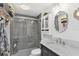 Updated bathroom featuring a glass shower and elegant vanity at 43411 State Road 19, Altoona, FL 32702