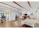Spacious bedroom with exposed beams, wood-look floors, and ample natural light at 43411 State Road 19, Altoona, FL 32702