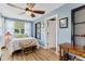 Bright bedroom featuring wood floors and a ceiling fan at 43411 State Road 19, Altoona, FL 32702