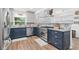 Modern kitchen with stainless steel appliances, granite countertops, and mosaic backsplash at 43411 State Road 19, Altoona, FL 32702