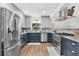 Well-lit kitchen with updated appliances, including stainless steel refrigerator, oven, and dishwasher at 43411 State Road 19, Altoona, FL 32702