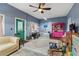 Spacious living area featuring blue walls, ample seating, and unique decor elements at 43411 State Road 19, Altoona, FL 32702