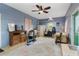Multi-purpose living area with blue walls, a ceiling fan, and ample space for various activities at 43411 State Road 19, Altoona, FL 32702