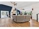 Spacious living area featuring a fireplace and an oversized sofa at 43411 State Road 19, Altoona, FL 32702