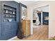Living area featuring blue accent wall with display shelves at 43411 State Road 19, Altoona, FL 32702