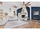 Open living room with high ceilings, a large fireplace, and ample natural light at 43411 State Road 19, Altoona, FL 32702
