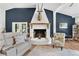 Cozy living room with statement fireplace and comfortable seating at 43411 State Road 19, Altoona, FL 32702