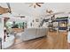 Bright, open-concept living and dining area with hardwood floors and unique decorative elements at 43411 State Road 19, Altoona, FL 32702