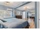 Large main bedroom showcasing wood floors, recessed lighting, and an ample closet with mirrored doors at 43411 State Road 19, Altoona, FL 32702