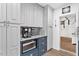 Well-organized pantry with blue lower cabinets and white upper cabinets offering ample storage at 43411 State Road 19, Altoona, FL 32702