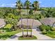 Aerial view of home with expansive back yard and views of a lake and nature preserve at 4547 Inverness Dr, Leesburg, FL 34748