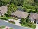 Aerial view showcasing the home, mature trees, landscaping, and screened-in pool at 4547 Inverness Dr, Leesburg, FL 34748