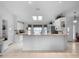 Bright and open kitchen with granite countertops, white cabinetry, and ample counter space at 4547 Inverness Dr, Leesburg, FL 34748