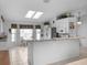 Spacious kitchen with granite countertops, stainless appliances, breakfast bar, and a sunlit dining area at 4547 Inverness Dr, Leesburg, FL 34748