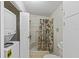 Bathroom with shower, and in-unit washer and dryer for added convenience at 522 Saint Andrews Blvd, Lady Lake, FL 32159
