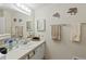 Bathroom with vanity, decorative dolphin accents, and plenty of space for storage at 522 Saint Andrews Blvd, Lady Lake, FL 32159