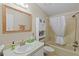 Bathroom with tub and shower, light countertop, and ample storage at 522 Saint Andrews Blvd, Lady Lake, FL 32159
