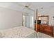 Bedroom with a bed and dresser, showing a view of the bedroom's interior at 522 Saint Andrews Blvd, Lady Lake, FL 32159