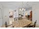 Dining room with view to kitchen and living room featuring modern furnishings at 522 Saint Andrews Blvd, Lady Lake, FL 32159