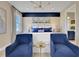 Chic bedroom features blue accents, modern furniture, and ample natural light creating a warm atmosphere at 5463 Nickerbean St, Apopka, FL 32712