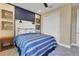 Charming bedroom featuring baseball themed wall decor, blue accent wall, and closet at 5463 Nickerbean St, Apopka, FL 32712