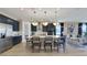 Open concept kitchen featuring large island with seating, modern appliances, and views into the living room at 5463 Nickerbean St, Apopka, FL 32712