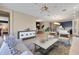 Open concept living space featuring modern furnishings, neutral tones, and seamless flow to the dining area at 5463 Nickerbean St, Apopka, FL 32712