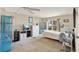 Bright bedroom with neutral walls, carpet floors, and window overlooking the yard at 741 Royal Palm Ave, Lady Lake, FL 32159