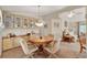 Charming dining space with display cabinets, pendant lighting, and a cozy atmosphere at 741 Royal Palm Ave, Lady Lake, FL 32159
