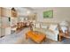 Cozy living room and dining area, featuring a comfortable sofa and a view into the dining area at 741 Royal Palm Ave, Lady Lake, FL 32159