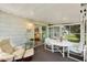 The enclosed patio features views of the yard and access to the living area at 741 Royal Palm Ave, Lady Lake, FL 32159