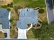 An aerial view reveals the home's manicured landscaping and inviting walkway at 8069 Se 174Th Ludlow Pl, The Villages, FL 32162