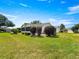 A view of a single Gathering home with a screened in porch at 8069 Se 174Th Ludlow Pl, The Villages, FL 32162