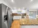 Well-lit kitchen with granite countertops and stainless steel appliances at 8069 Se 174Th Ludlow Pl, The Villages, FL 32162