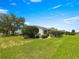A lush green lawn and manicured shrubbery add beauty to this home at 8069 Se 174Th Ludlow Pl, The Villages, FL 32162
