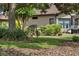 Scenic backyard featuring lush greenery, beautiful landscaping, and native wildlife near the home at 8167 Bridgeport Bay Cir, Mount Dora, FL 32757