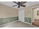 Comfortable bedroom with a ceiling fan, carpet, and a built-in closet for storage at 8167 Bridgeport Bay Cir, Mount Dora, FL 32757