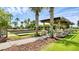 Multiple bocce ball courts with covered seating areas offer a great activity surrounded by landscaped paths at 8167 Bridgeport Bay Cir, Mount Dora, FL 32757